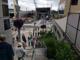 After crossing the Gibbs Street pedestrian bridge over the I5 freeway, the walkers descended the stairs to the base of the Portland Aerial Tram.